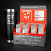 LMNT electrolyte drink mix packaging with a black tumbler on a dark background