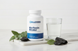 CellCore BioToxin Binder lifestyle image on marble surface with wellness props